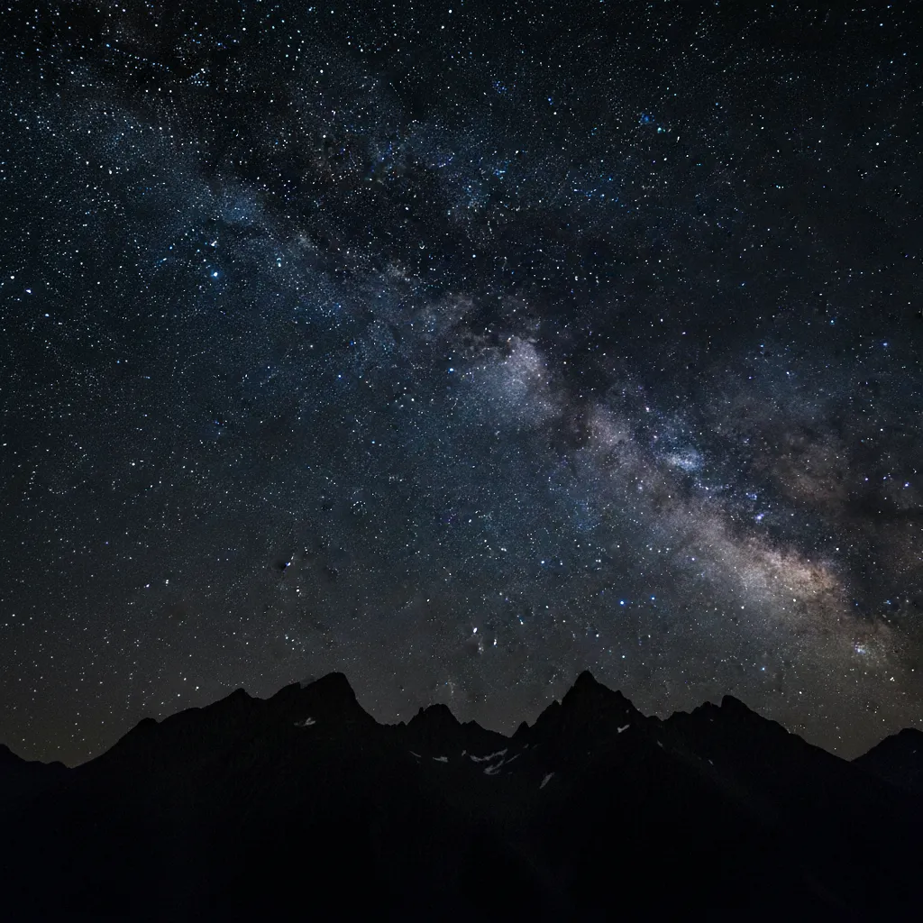 Matariki star cluster rising over mountains